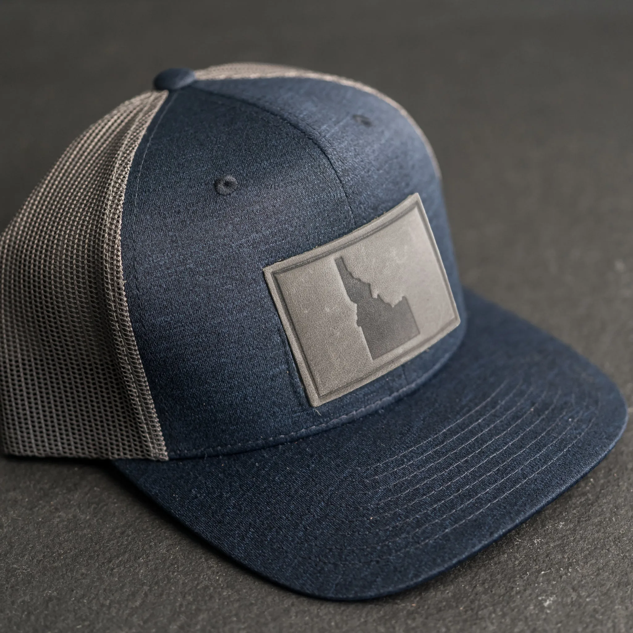 Leather Patch Performance Style Trucker Hat - Idaho Stamp