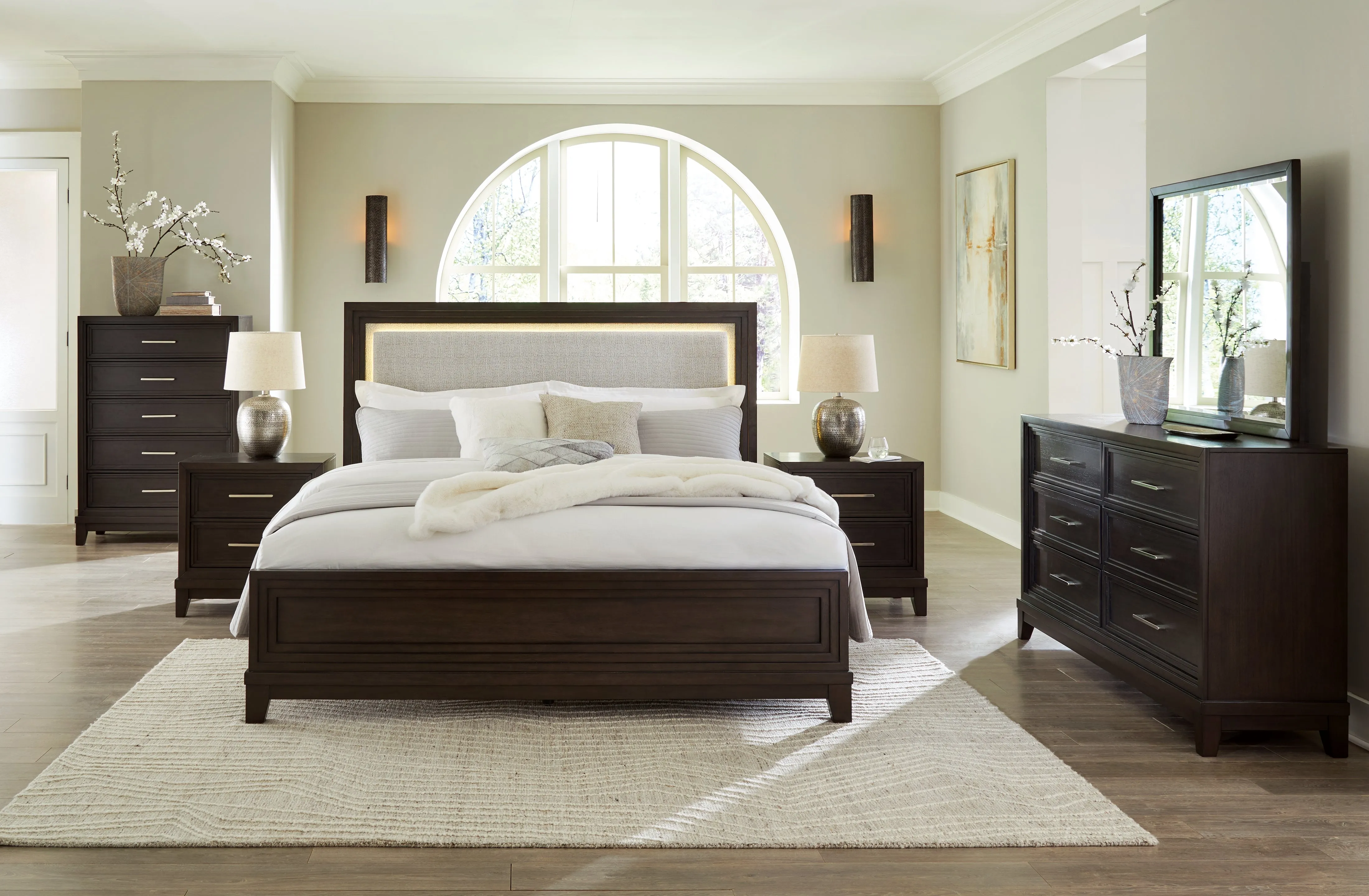 Neymorton Queen Upholstered Panel Bed with Mirrored Dresser, Chest and 2 Nightstands in Dark Grayish Brown